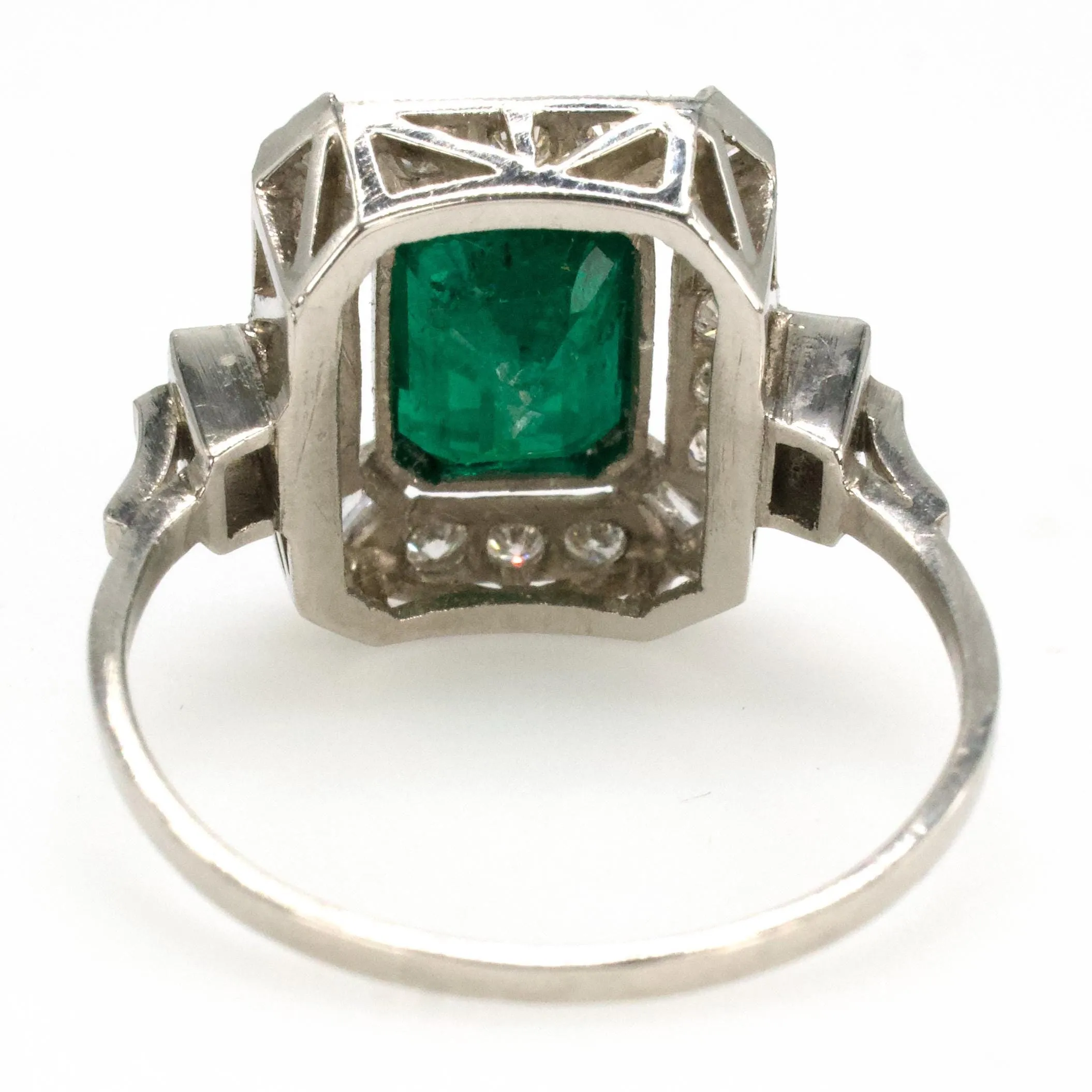 Estate 1.40 Carat Emerald Cut Emerald in Art Deco Style White Gold Setting with Diamond Halo